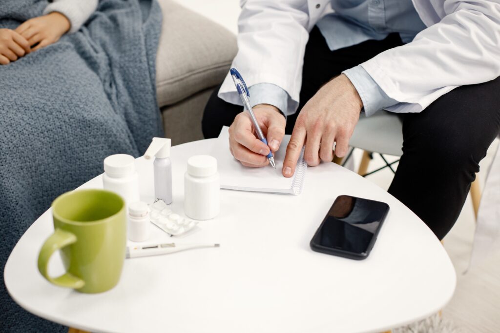 cropped photo male pediatrician writing down prescription sick little black girl